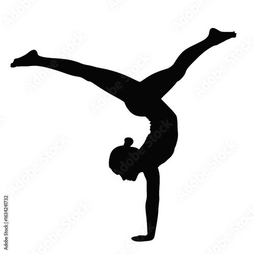 Silhouette of a female gymnast performing a handstand