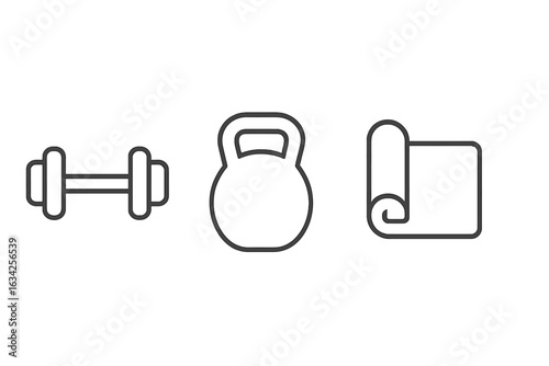 Fitness equipment setup includes dumbbell, kettlebell, and yoga mat for a workout session at home