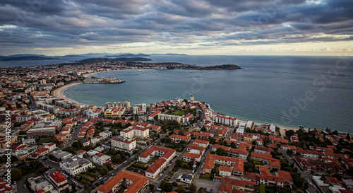 Aerial View of Set?bal, Portugal: Coastal Cityscape with Red-Tiled Roofs and Ocean Vista
