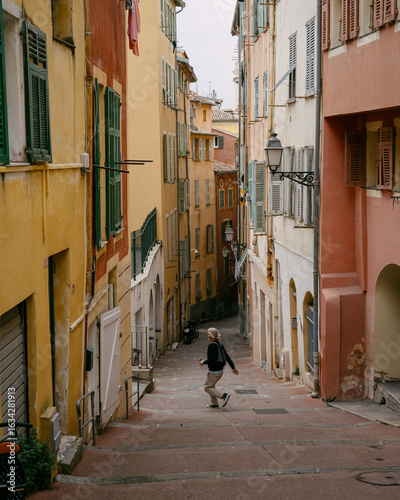 Charming Mediterranean Alley With Vibrant Pastel Buildings and Cobblestone Steps