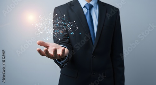 Wallpaper Mural Businessman holding a glowing digital network in his open palm showcasing global connections and technology Torontodigital.ca