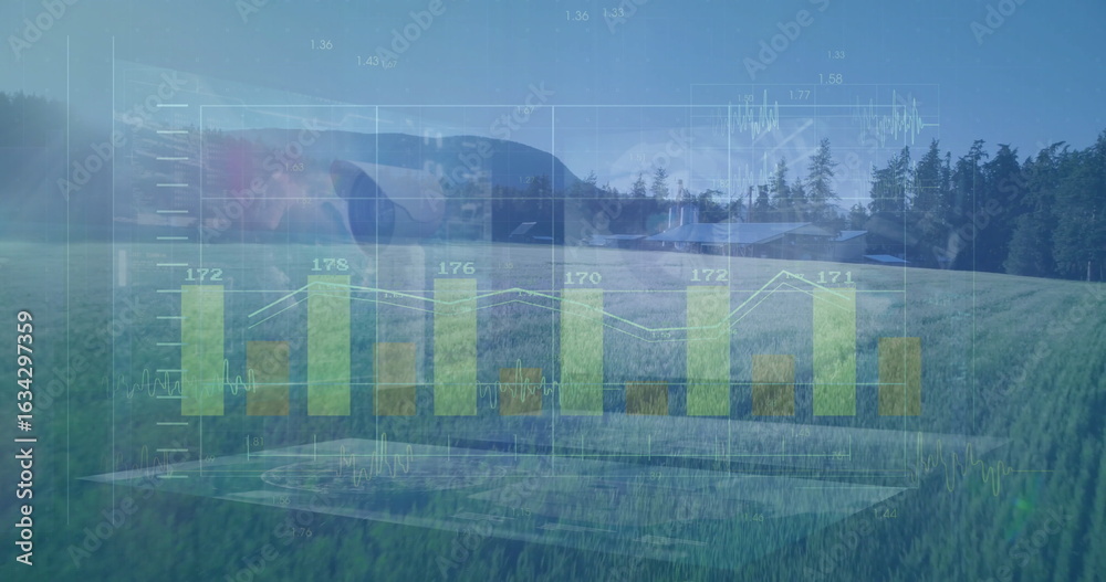 Fototapeta premium Displaying translucent green bar chart with white line graph over rural meadow at forest edge,