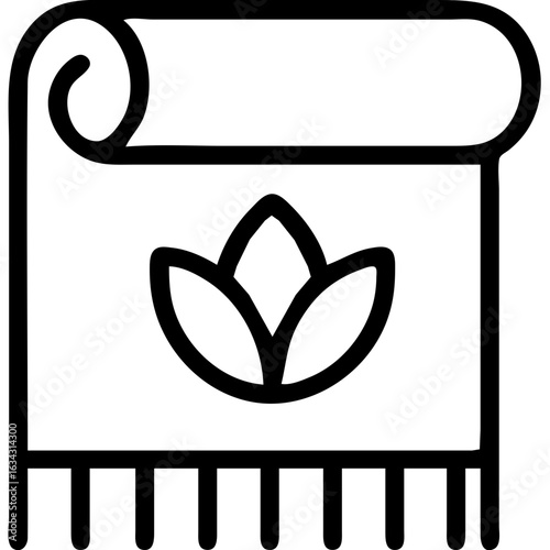 A towel for yoga with a leaf on it. The towel is hanging on a rack