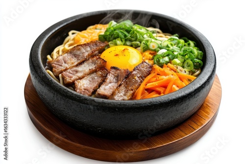 Korean bibimbap with beef and egg isolated on white background