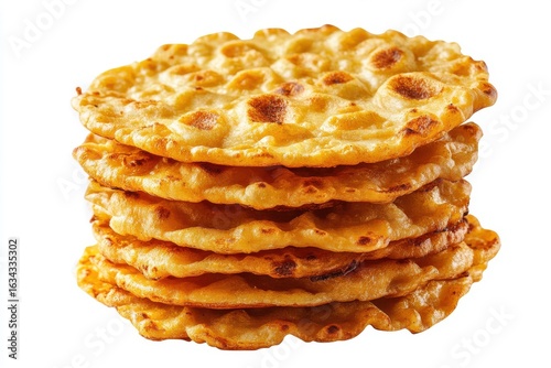 Stack of golden fried savory pancakes isolated on white background