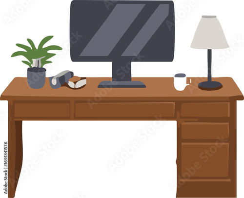 A wooden office desk with a computer monitor, lamp, houseplant, book, and a coffee mug.