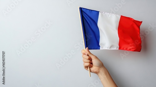Hand Holding French National Flag for Bastille Day, Celebration, Cultural Symbol Scenarios