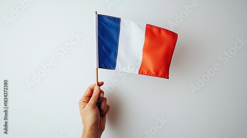 Hand Holding French National Flag for Bastille Day, Celebration, Cultural Symbol Scenarios