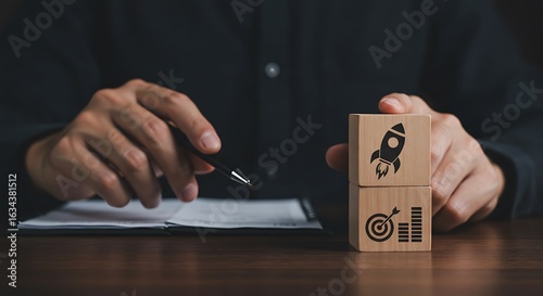Rocket launching from wood cube with business icon, Start-up, Creativity, Big idea, Business goals management, Investment on new project to wealth, Company strategy target, Sustainable financial plan
