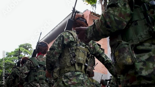 Armed soldiers ready for war, military troops with rifles, combat-ready infantry forces. High quality FullHD footage