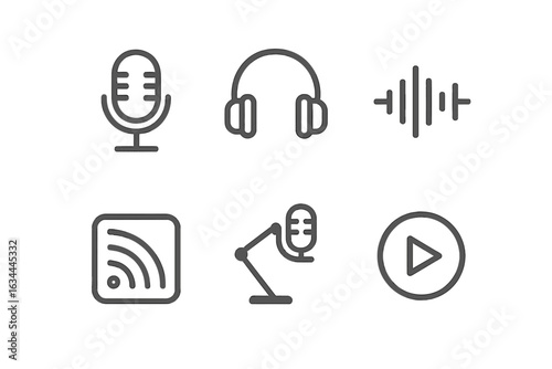Equipment used for audio recording and streaming in a modern studio setting with headphones and microphones
