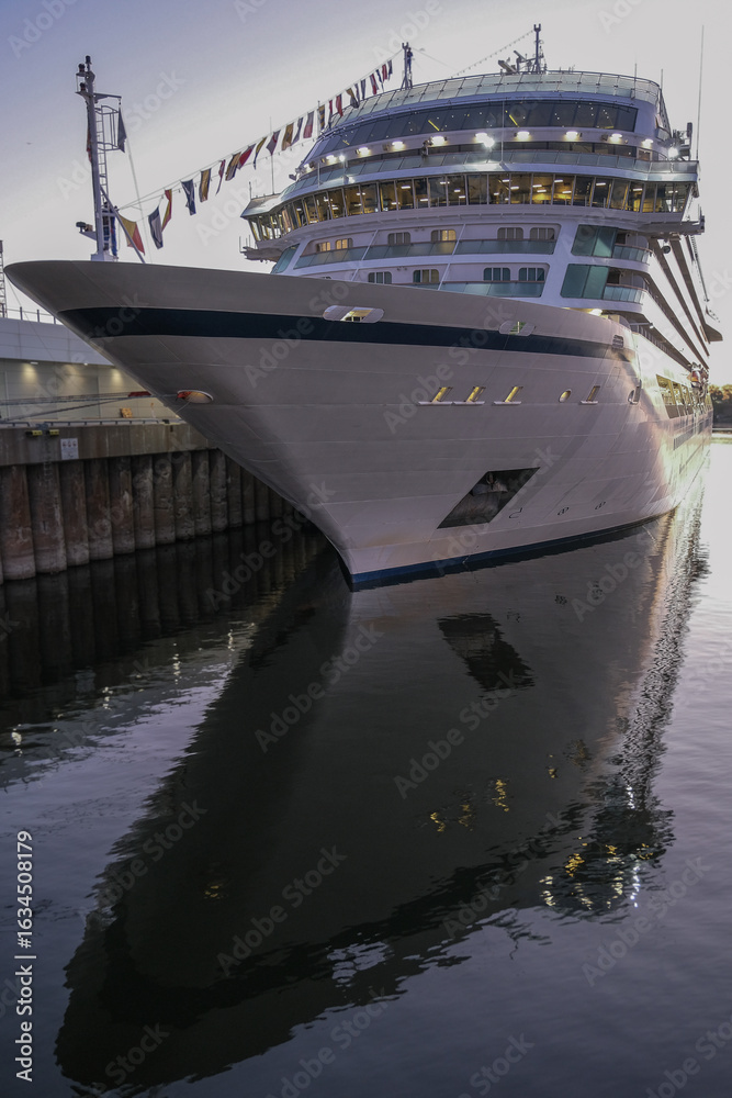 Fototapeta premium All inclusive luxury yacht cruiseship cruise ship liner Star docked in port St. Lawrence River in Montreal, Quebec Canada during New England Indian Summer cruising