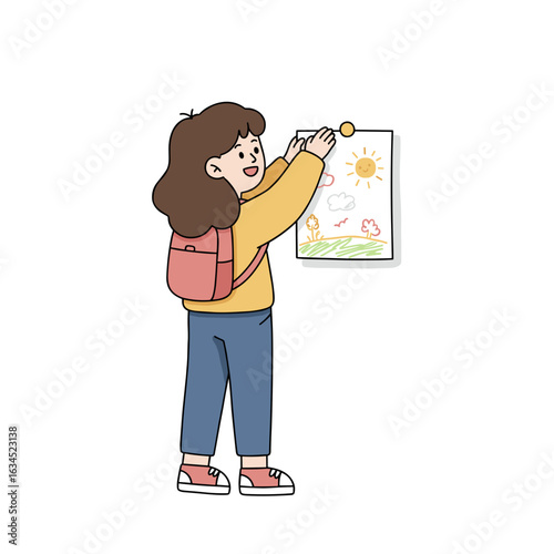Happy girl hanging drawing on wall while wearing backpack indoors  