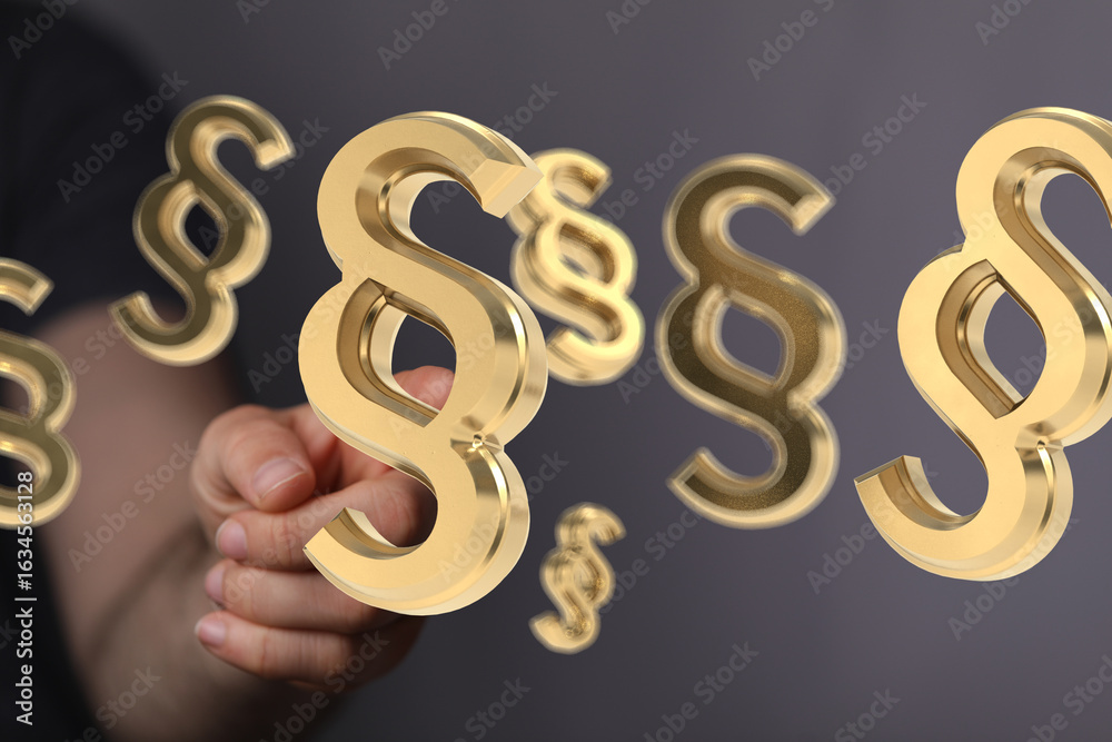 Abstract image of 3D golden paragraph symbols floating, symbolizing law, legal, or contract concepts. Abstract image of 3D golden paragraph symbols floating, symbolizing law, legal, or contract concepts.