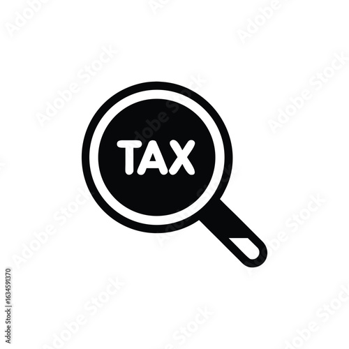 Magnifying glass focused on the word tax
