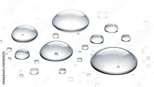 Macro view of translucent water droplets reflecting light on a dark textured surface