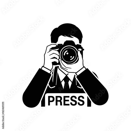 Person holding a camera with the word "PRESS" on their chest.