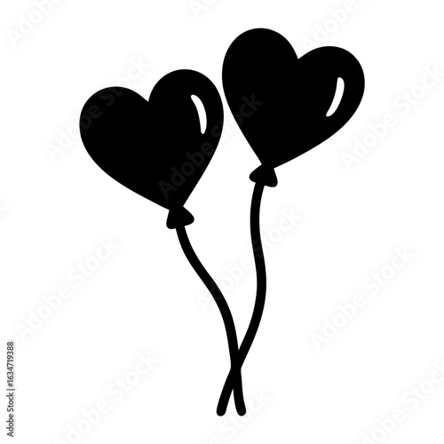Two black heart shaped balloons floating gracefully in the air together
