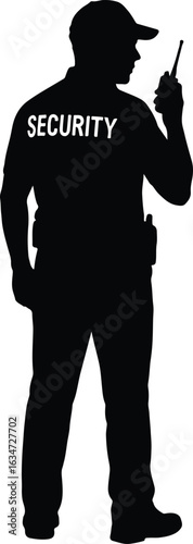 Silhouette of a security guard in uniform communicating through a walkie talkie for safety and protection