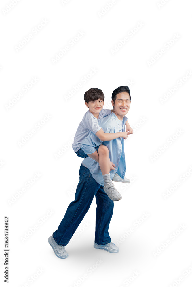 Father giving son a piggyback ride and both smile while looking at the camera on white background Father giving son a piggyback ride and both smile while looking at the camera on white background
