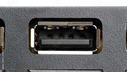 Macro closeup of an USB type A female port on a computer device, frontal view of empty standard interface connector socket, input output power charging and data transfer concept, back panel detail