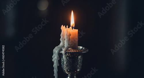 Candle Flame in Silver Holder for Yom Kippur Reflection, Spiritual Practices, Religious Observance, Meditation Spaces, and Cultural Awareness  