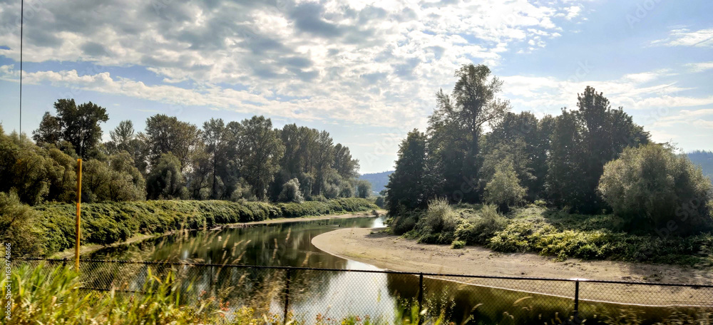 Fototapeta premium A river flowing through the countryside