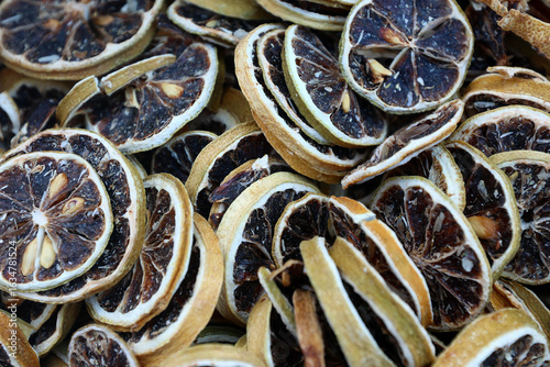 Obraz na plátně Close-up of dried lemon slices with darkened centers and preserved rinds