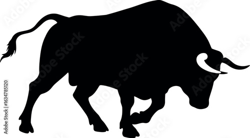 Powerful bull silhouette charging forward