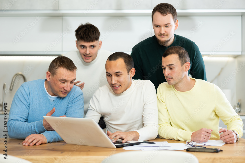 Fototapeta premium Group of friends communicate via video conference using laptop