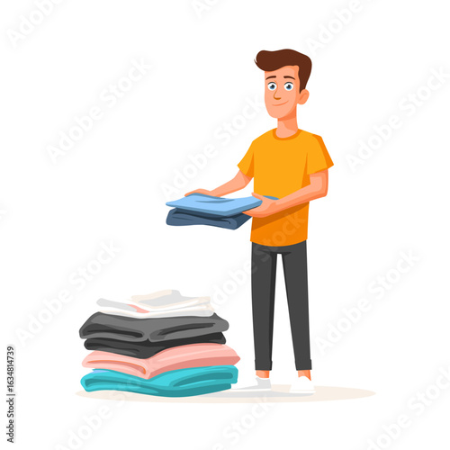 A man happily folding clean clothes.