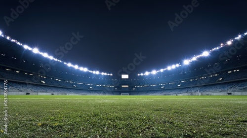 Empty football arena under evening lights casting dramatic elongated shadows, perfect for sports news coverage or event promotion materials.