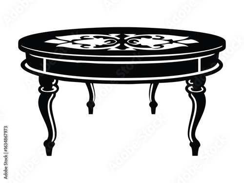 A round ornate wooden table in black and white