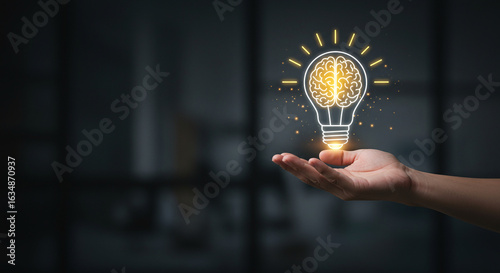 Hand Holding Glowing Lightbulb Brain; Innovation, Idea, Inspiration Concept; Dark Background