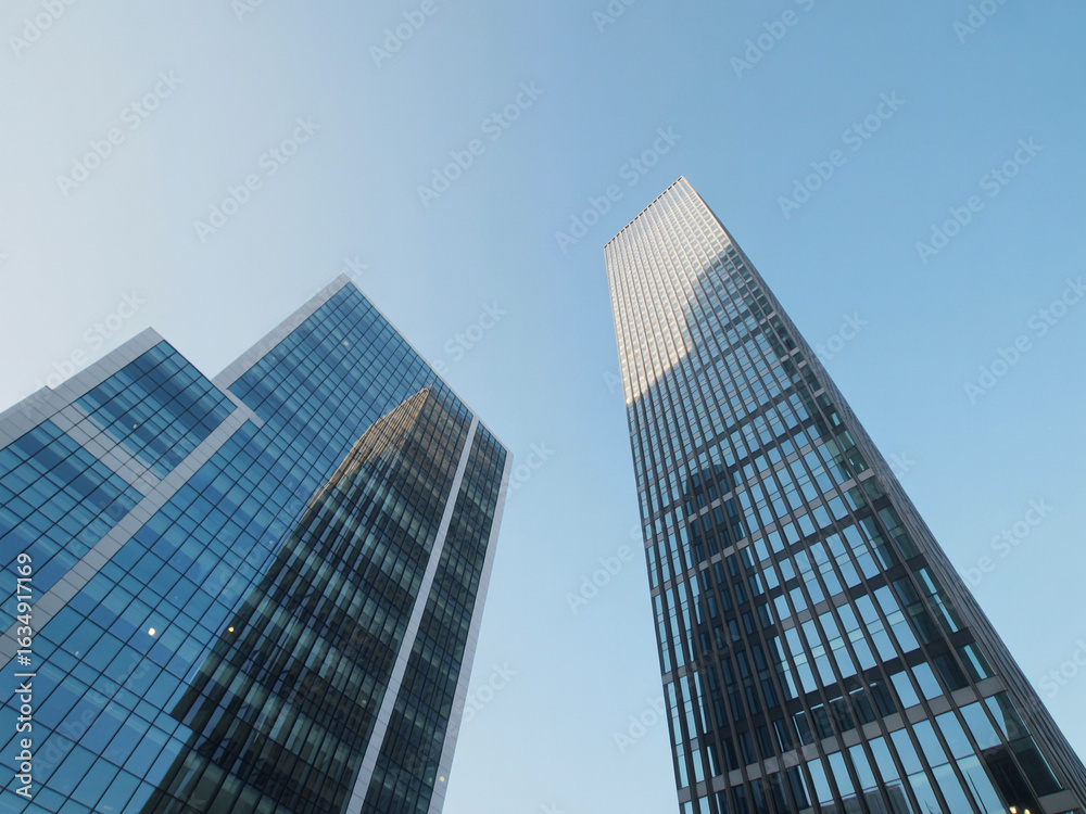 Blue glass skyscrapers against clear sky building architecture Blue glass skyscrapers against clear sky building architecture