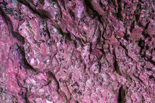Natural cave texture with pink and black hues