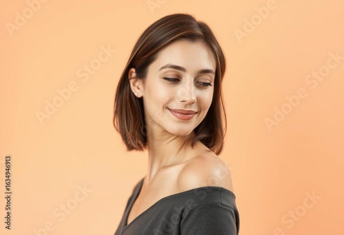 Soft focus portrait of a relaxed female on a warm background