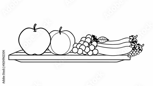 Fresh produce arrangement featuring apples grapes and bananas on a platter a simple healthy food concept