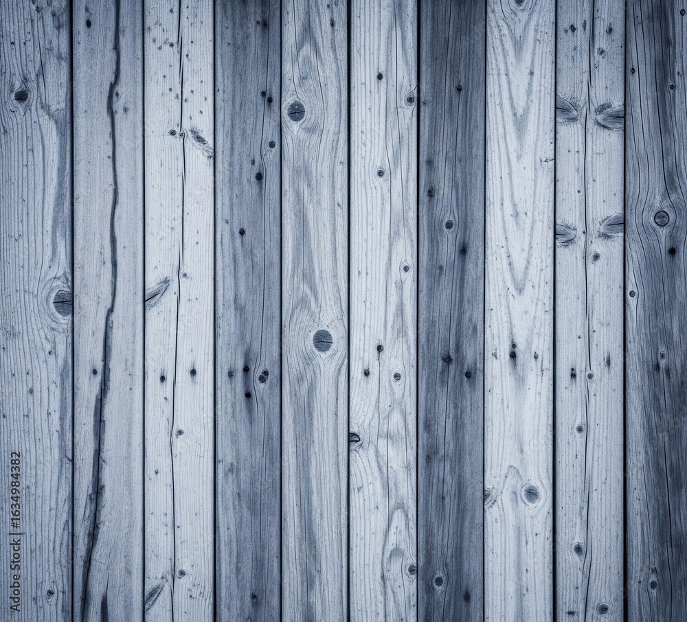 Naklejka premium A modern and rustic wood paneling background, featuring grey-blue stained or weathered vertical boards