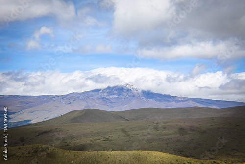 Pichincha Province, Quito, Ecuador - July 5, 2025: The summit of the Sincholagua Volcano, covered by clouds, seen from Pasochoa Volcano, in the Pasochoa Wildlife Refuge.