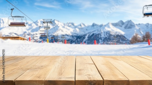 Empty wooden table blurred snow covered mountains ski lifts winter scenery blue sky bright sunlight