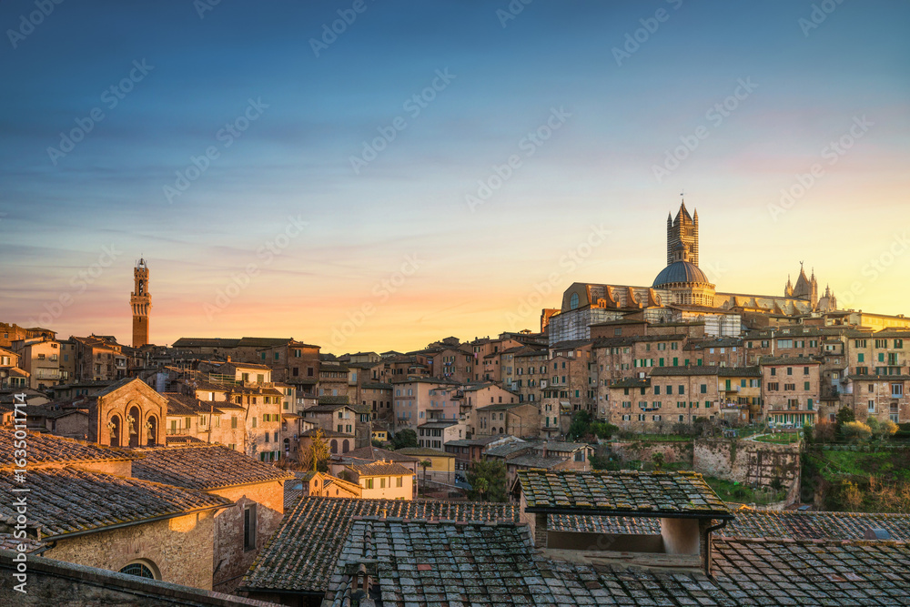 Fototapeta premium Siena sunset panoramic skyline. Mangia Tower and Cathedral Duomo. Tuscany, Italy