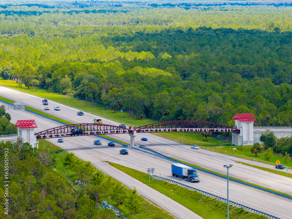 Naklejka premium Aerial telephoto Trans Florida Central Railroad Trail over I95