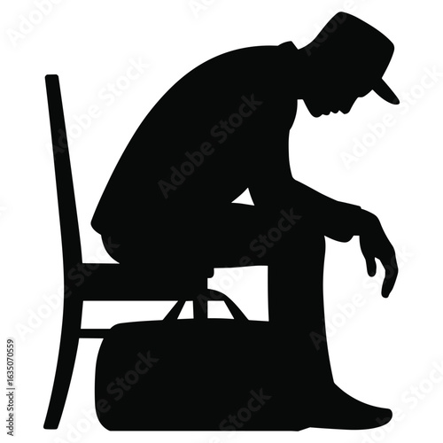 Sad man sitting on chair with briefcase silhouette