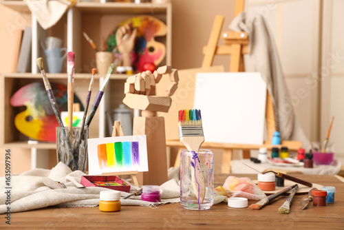 Glass with brushes, paints ...