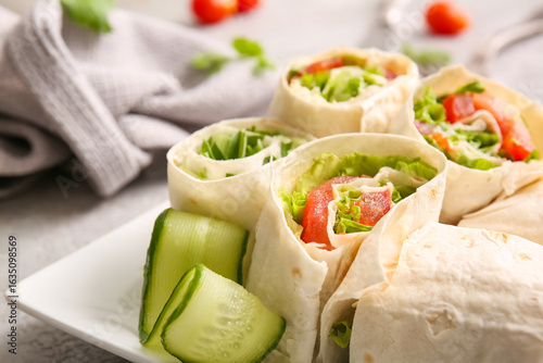 Plate of tasty lavash rolls...