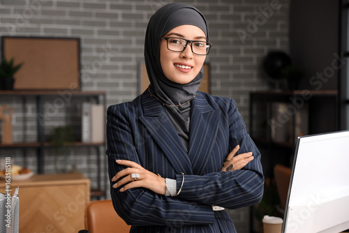 Muslim businesswoman working in office