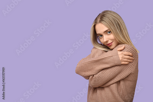 Young woman embracing herse...