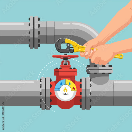 Repairing city communications with turning valve on gas pipe, worker with adjustable wrench servicing valve. City communications maintenance includes worker adjusting a pipeline valve and a pipeline,