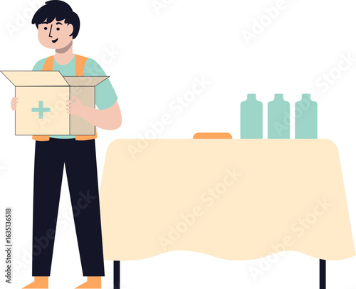 A volunteer holding a box with a medical cross, preparing for a distribution event.